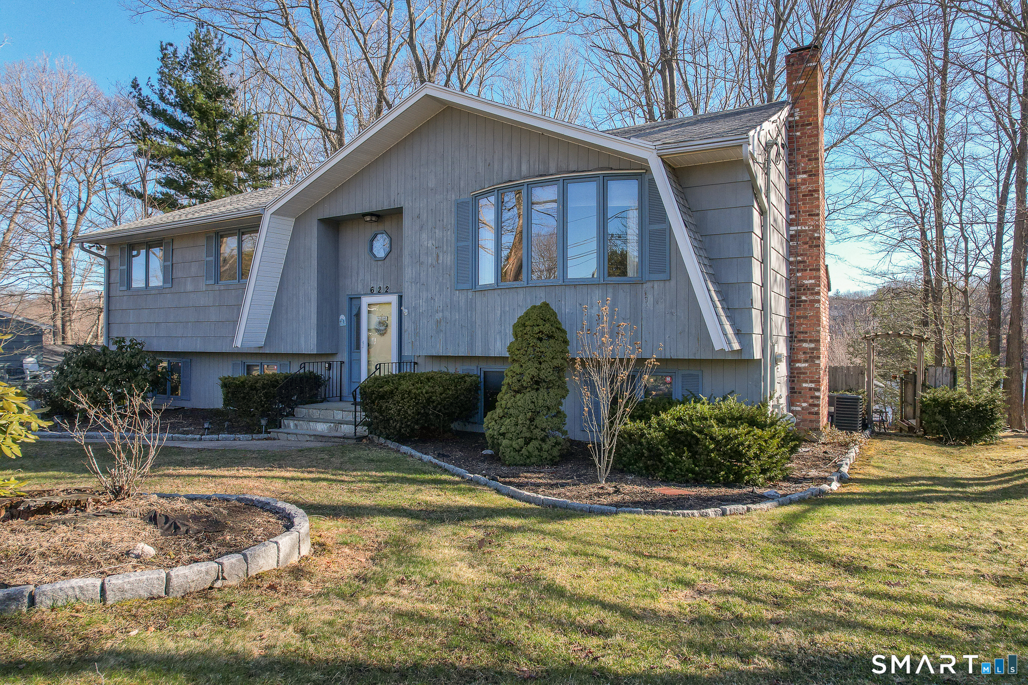 622 Lakeside Boulevard West Waterbury, CT 06708 - Photo 4 of 40 a view of a house with swimming pool next to a yard
