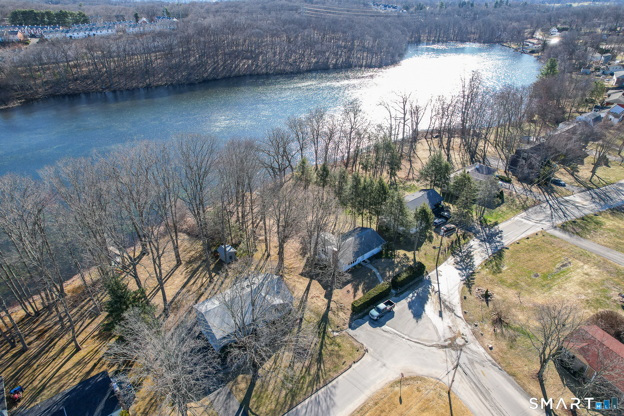 622 Lakeside Boulevard West Waterbury, CT 06708 - Photo 5 of 40 a view of a lake with a yard