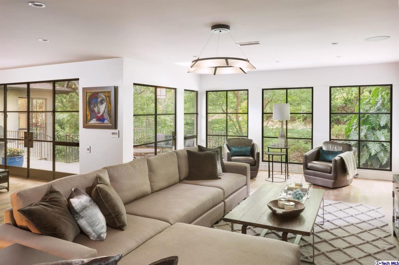 885 Laguna Road Pasadena, CA 91105 - Photo 13 of 33 a living room with furniture and a large window