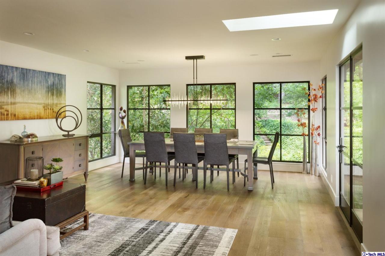 885 Laguna Road Pasadena, CA 91105 - Photo 14 of 33 a view of a dining room with furniture window and wooden floor