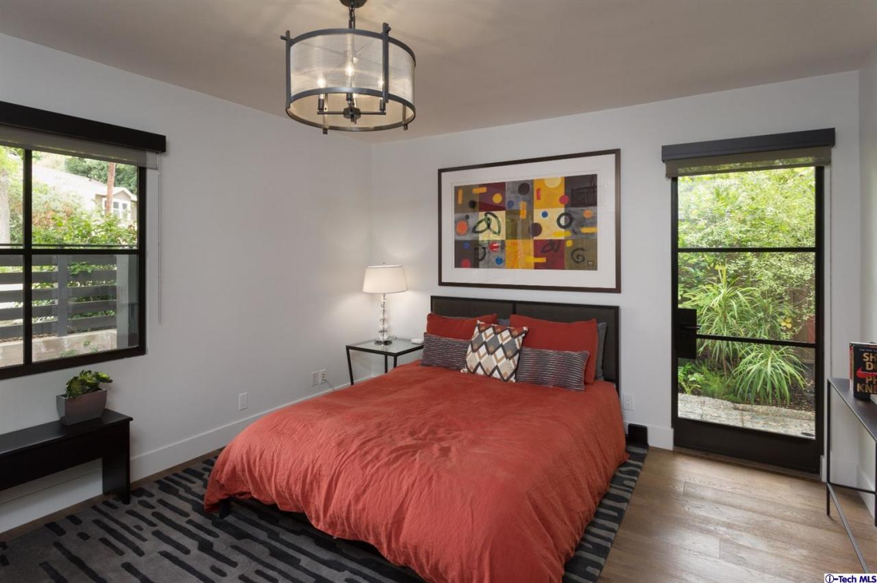885 Laguna Road Pasadena, CA 91105 - Photo 15 of 33 a bedroom with a large bed and a window