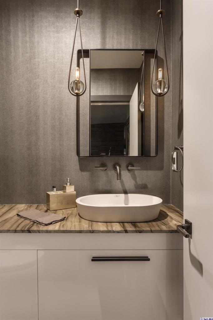 885 Laguna Road Pasadena, CA 91105 - Photo 17 of 33 a bathroom with a granite countertop sink a mirror and shower