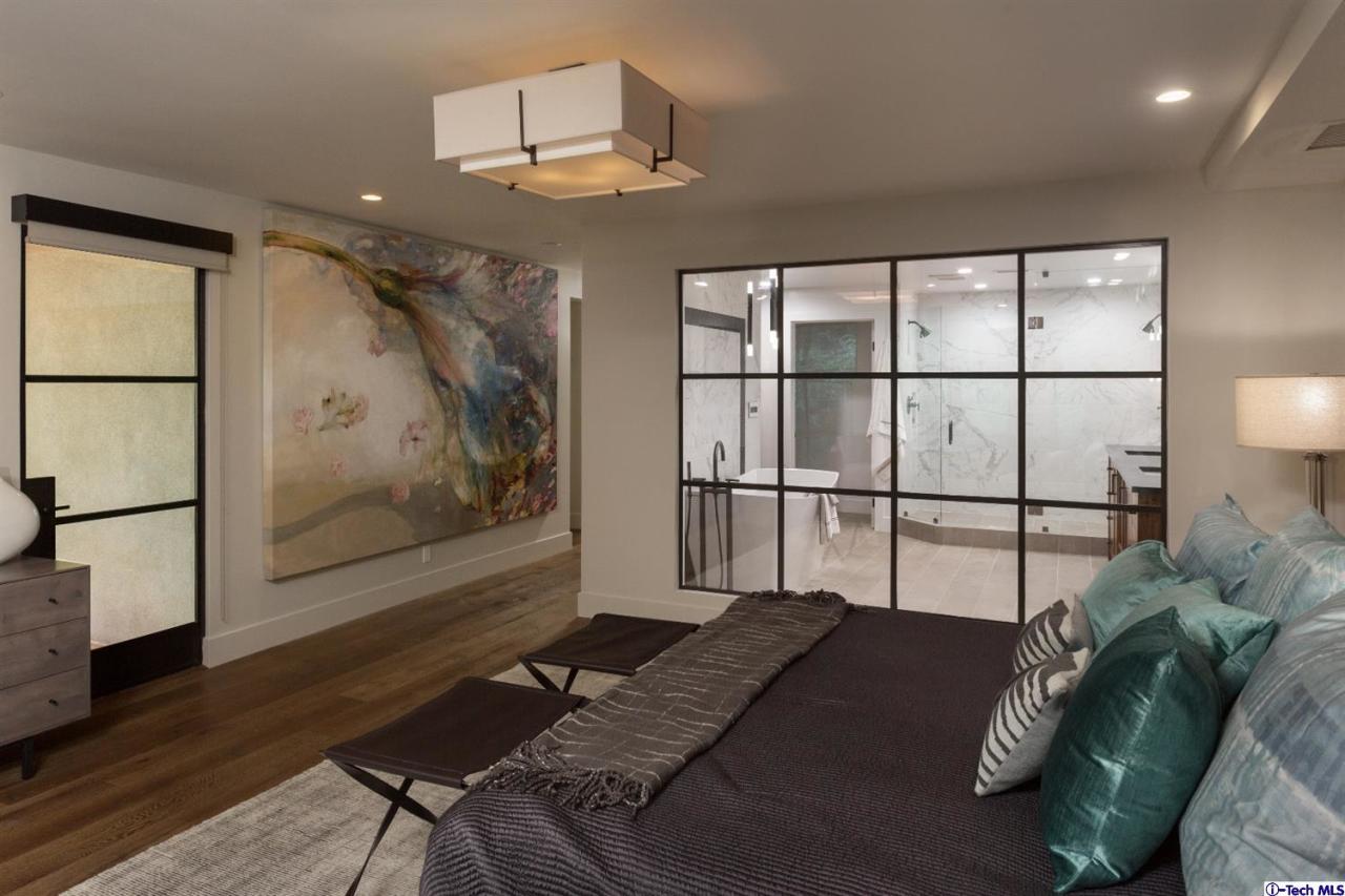 885 Laguna Road Pasadena, CA 91105 - Photo 24 of 33 a bed sitting in a bedroom next to a window