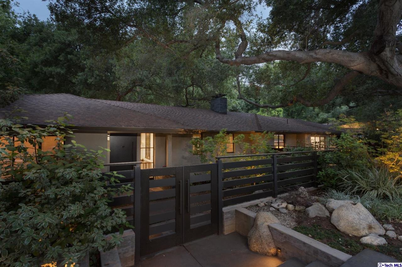 885 Laguna Road Pasadena, CA 91105 - Photo 4 of 33 front view of a house with a yard