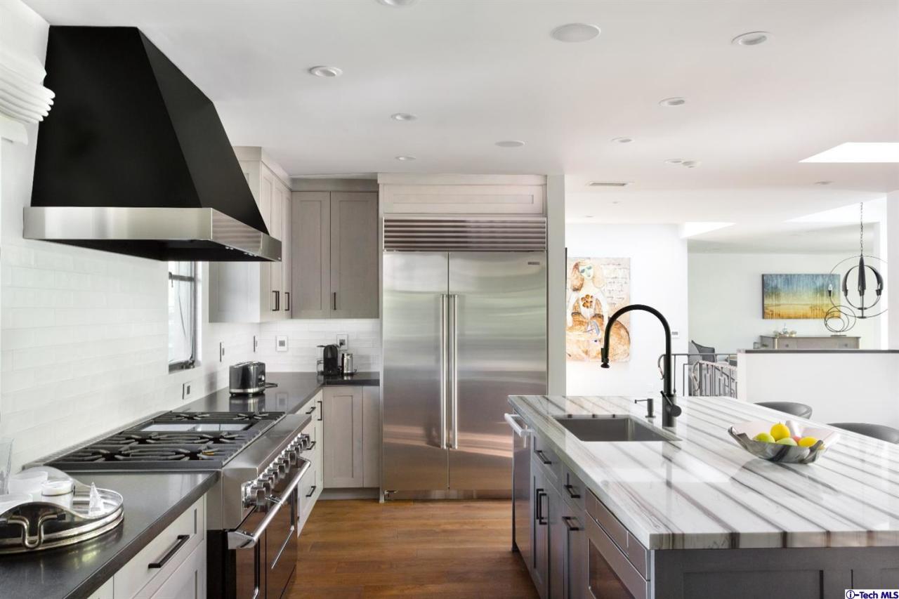 885 Laguna Road Pasadena, CA 91105 - Photo 7 of 33 a kitchen with a stove a sink and a refrigerator