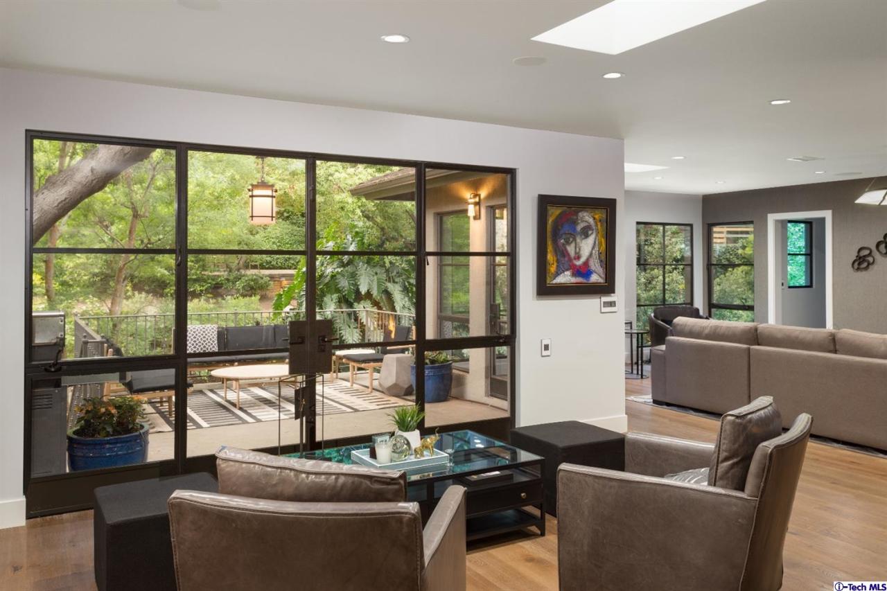 885 Laguna Road Pasadena, CA 91105 - Photo 10 of 33 a living room with furniture and a floor to ceiling window