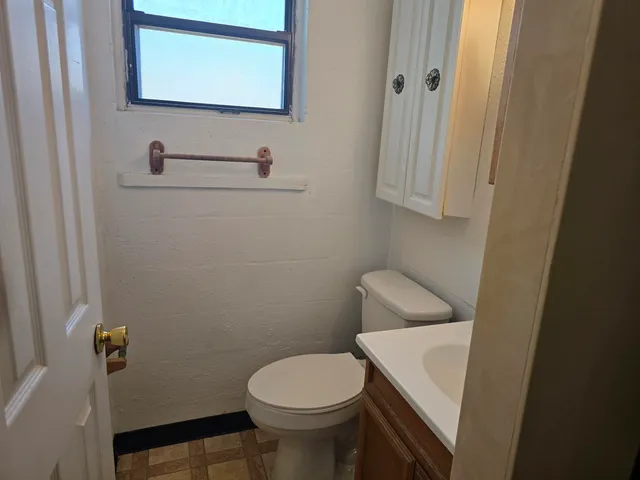 a bathroom with a sink and toilet