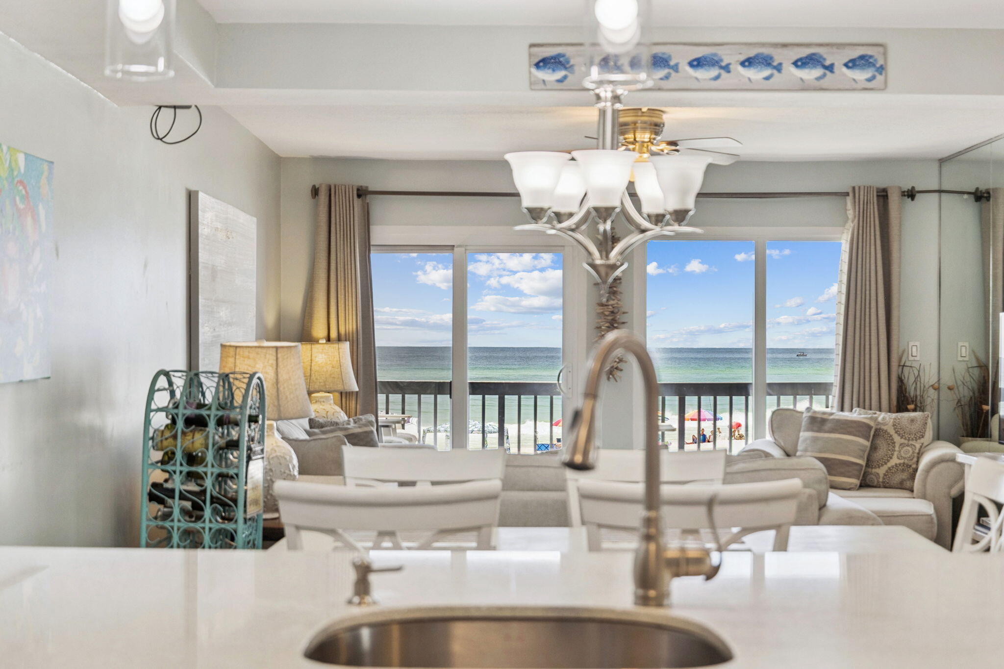 23223 Front Beach Road, Unit C3201 Panama City Beach, FL 32413 - Photo 13 of 45 a view of living room with a chandelier and couches