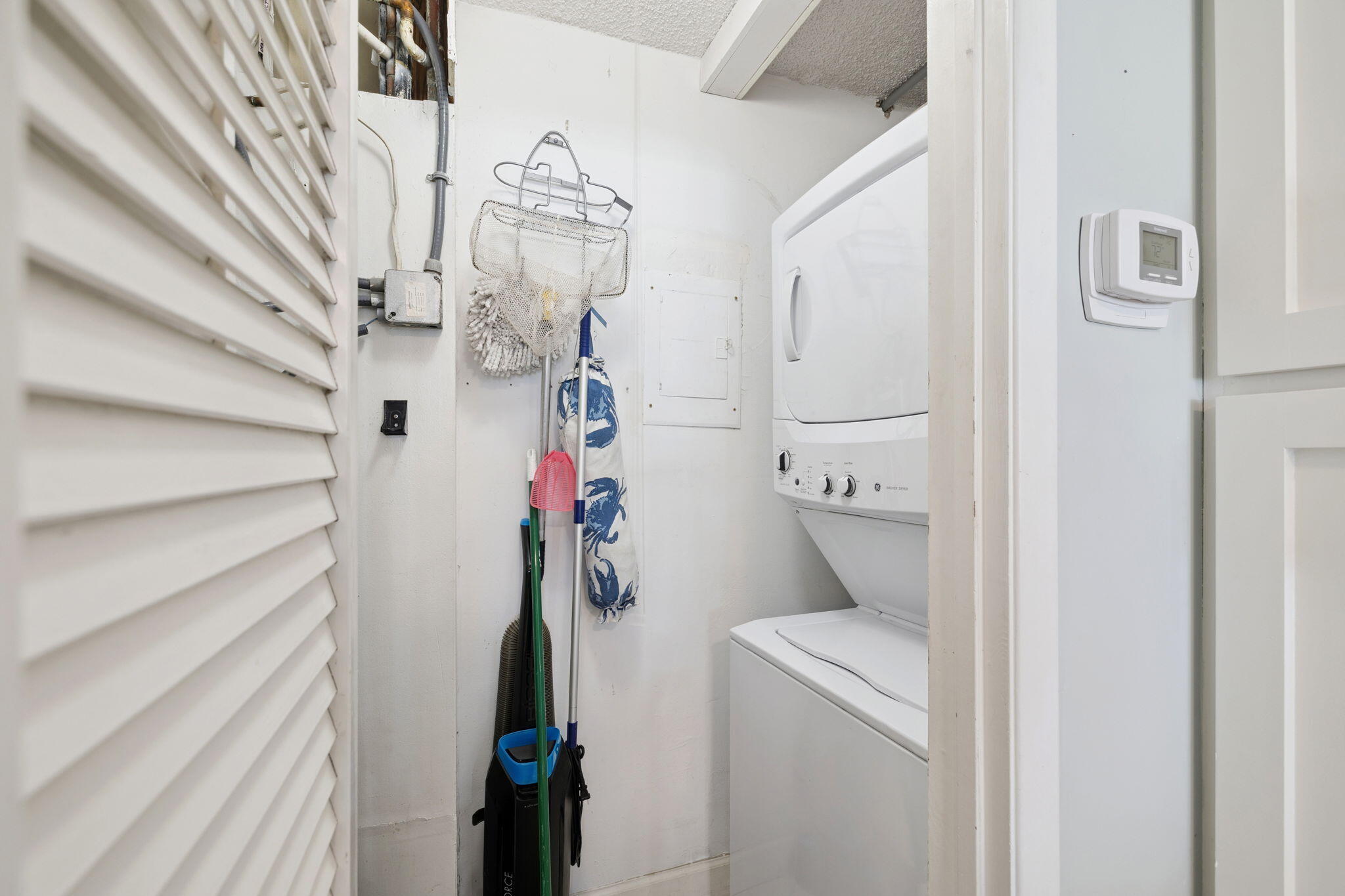 23223 Front Beach Road, Unit C3201 Panama City Beach, FL 32413 - Photo 15 of 45 a room that has a washer and dryer