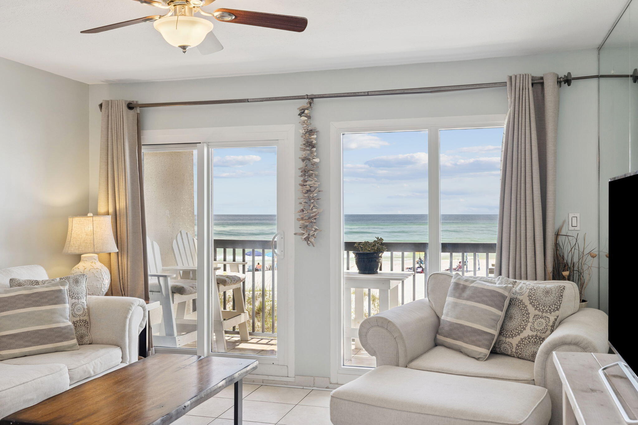 23223 Front Beach Road, Unit C3201 Panama City Beach, FL 32413 - Photo 19 of 45 a living room with furniture and a large window