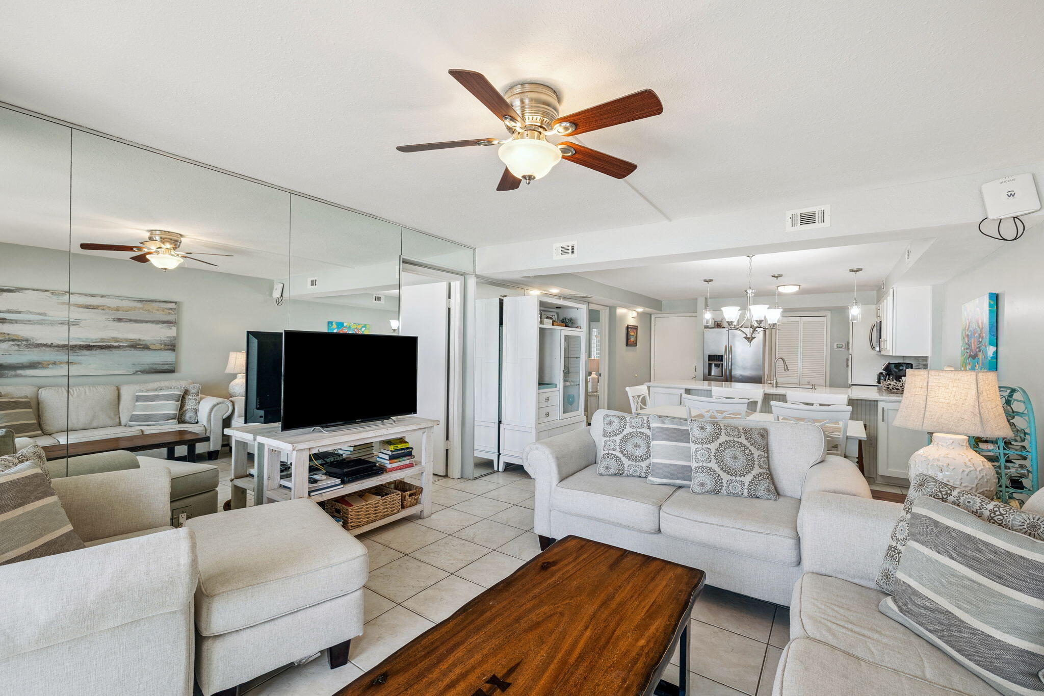 23223 Front Beach Road, Unit C3201 Panama City Beach, FL 32413 - Photo 21 of 45 a living room with furniture and a flat screen tv