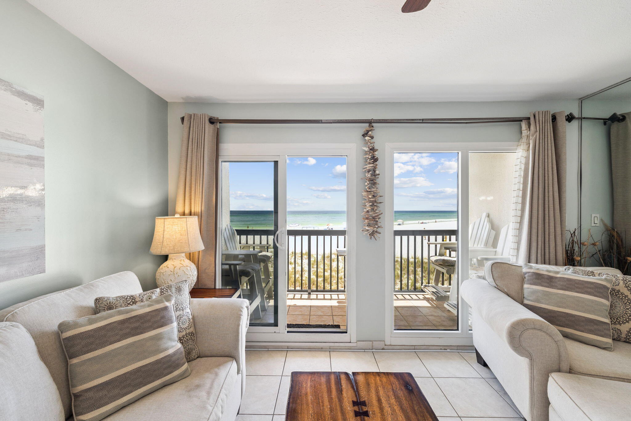 23223 Front Beach Road, Unit C3201 Panama City Beach, FL 32413 - Photo 22 of 45 a living room with furniture and a large window