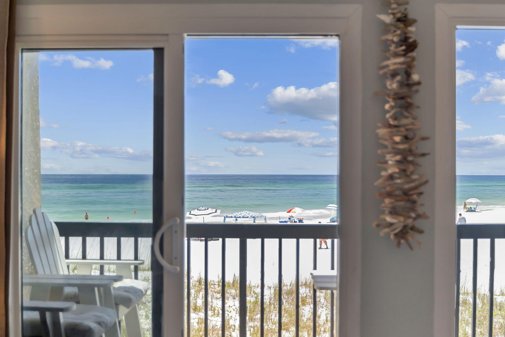 23223 Front Beach Road, Unit C3201 Panama City Beach, FL 32413 - Photo 23 of 45 a view of a balcony with floor to ceiling window and wooden floor