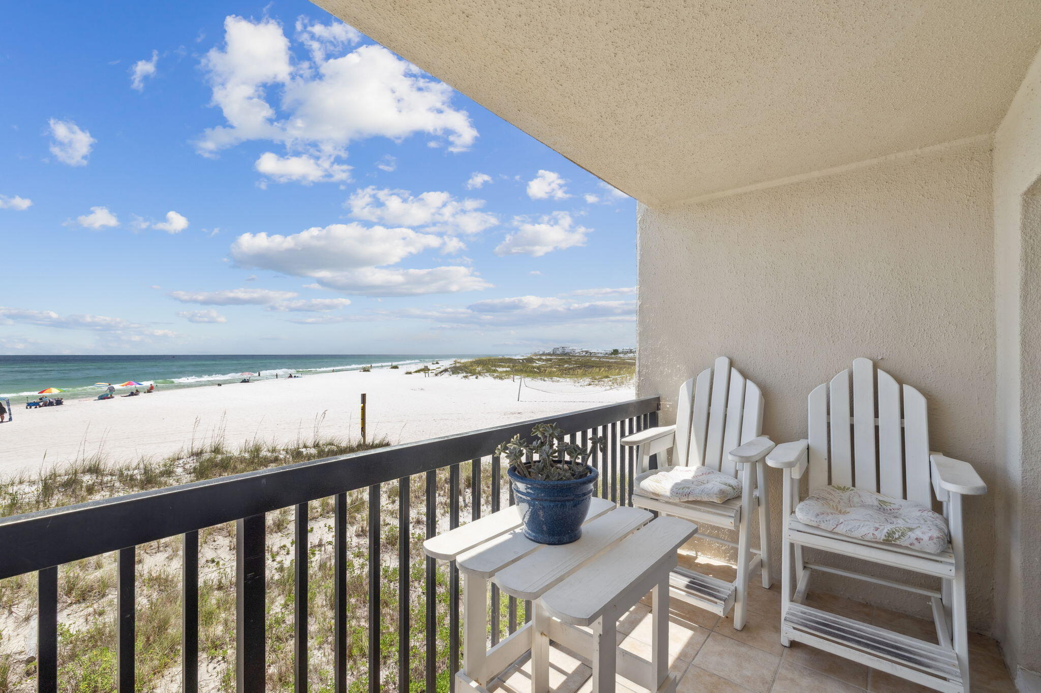 23223 Front Beach Road, Unit C3201 Panama City Beach, FL 32413 - Photo 24 of 45 a view of a balcony with wooden chairs