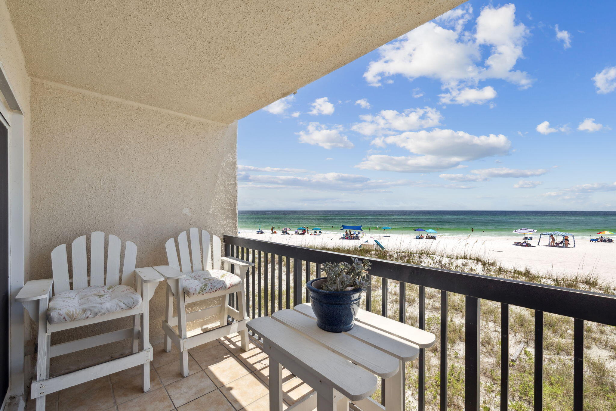 23223 Front Beach Road, Unit C3201 Panama City Beach, FL 32413 - Photo 26 of 45 a view of a chairs and table in the balcony