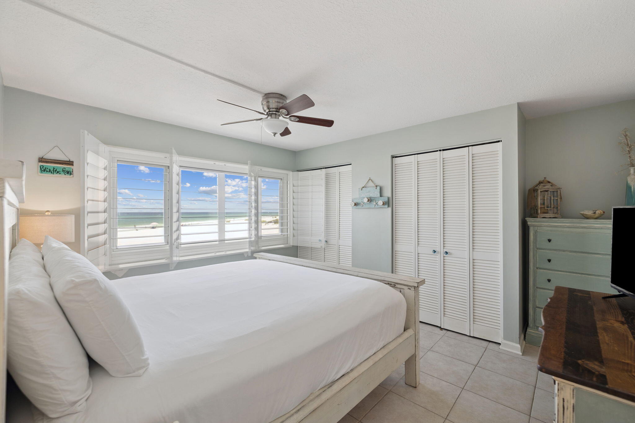 23223 Front Beach Road, Unit C3201 Panama City Beach, FL 32413 - Photo 29 of 45 a spacious bedroom with a large bed and a tv