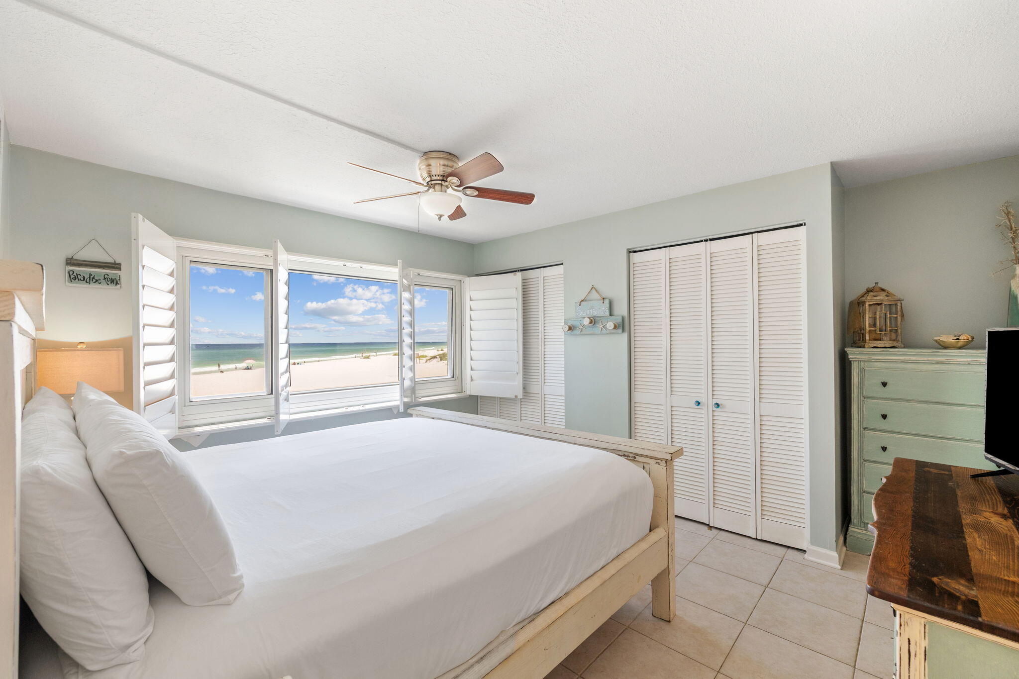 23223 Front Beach Road, Unit C3201 Panama City Beach, FL 32413 - Photo 31 of 45 a bedroom with a large bed and a window