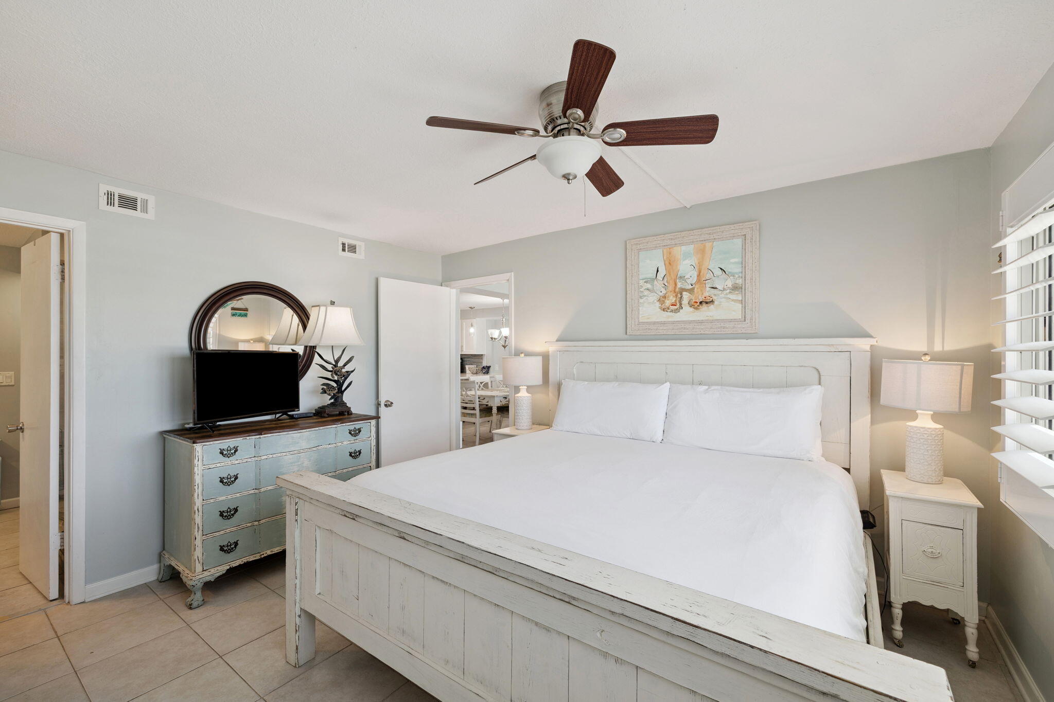 23223 Front Beach Road, Unit C3201 Panama City Beach, FL 32413 - Photo 33 of 45 a bedroom with a bed and a chandelier