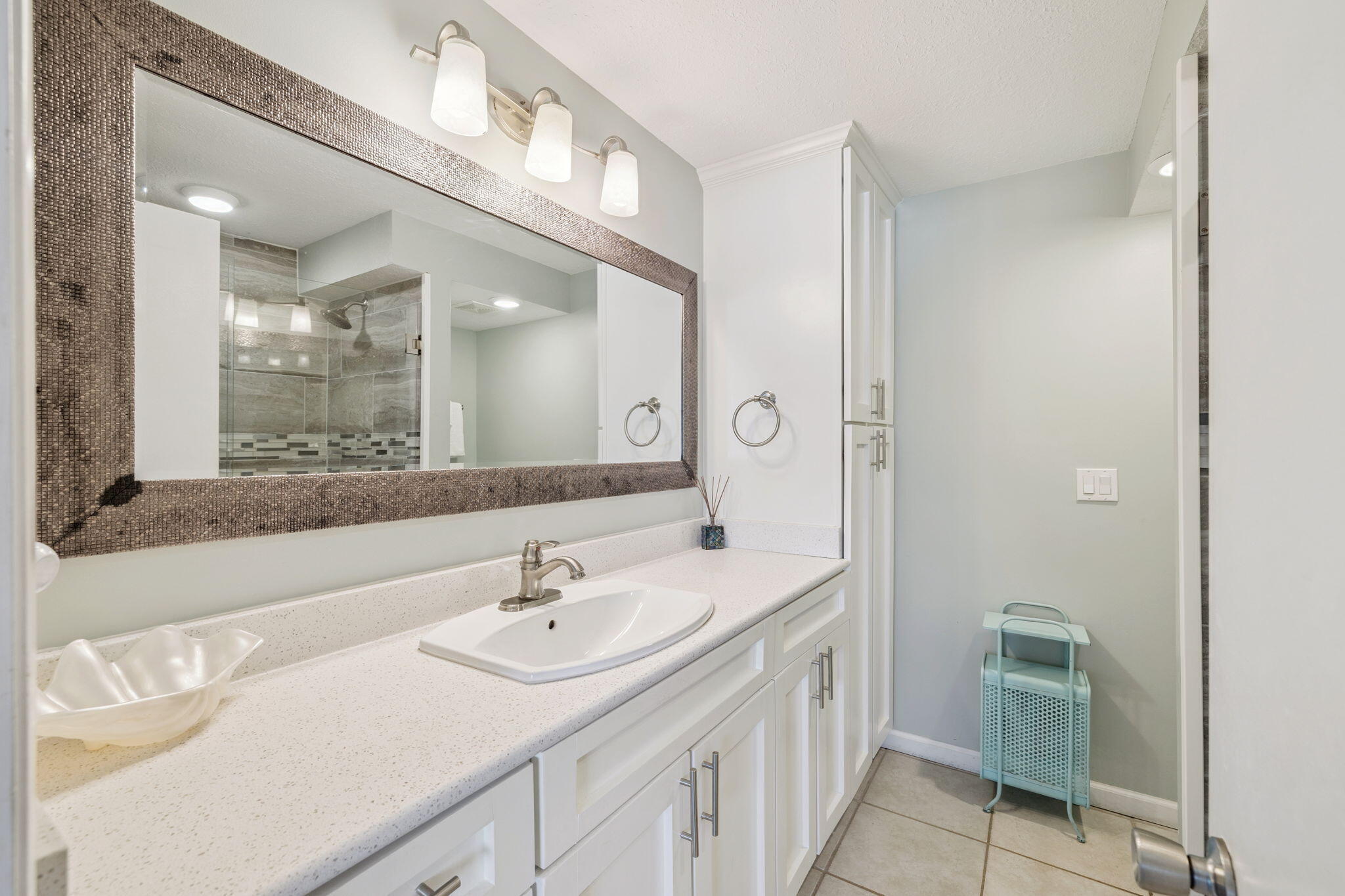 23223 Front Beach Road, Unit C3201 Panama City Beach, FL 32413 - Photo 34 of 45 a bathroom with a sink double vanity and a mirror
