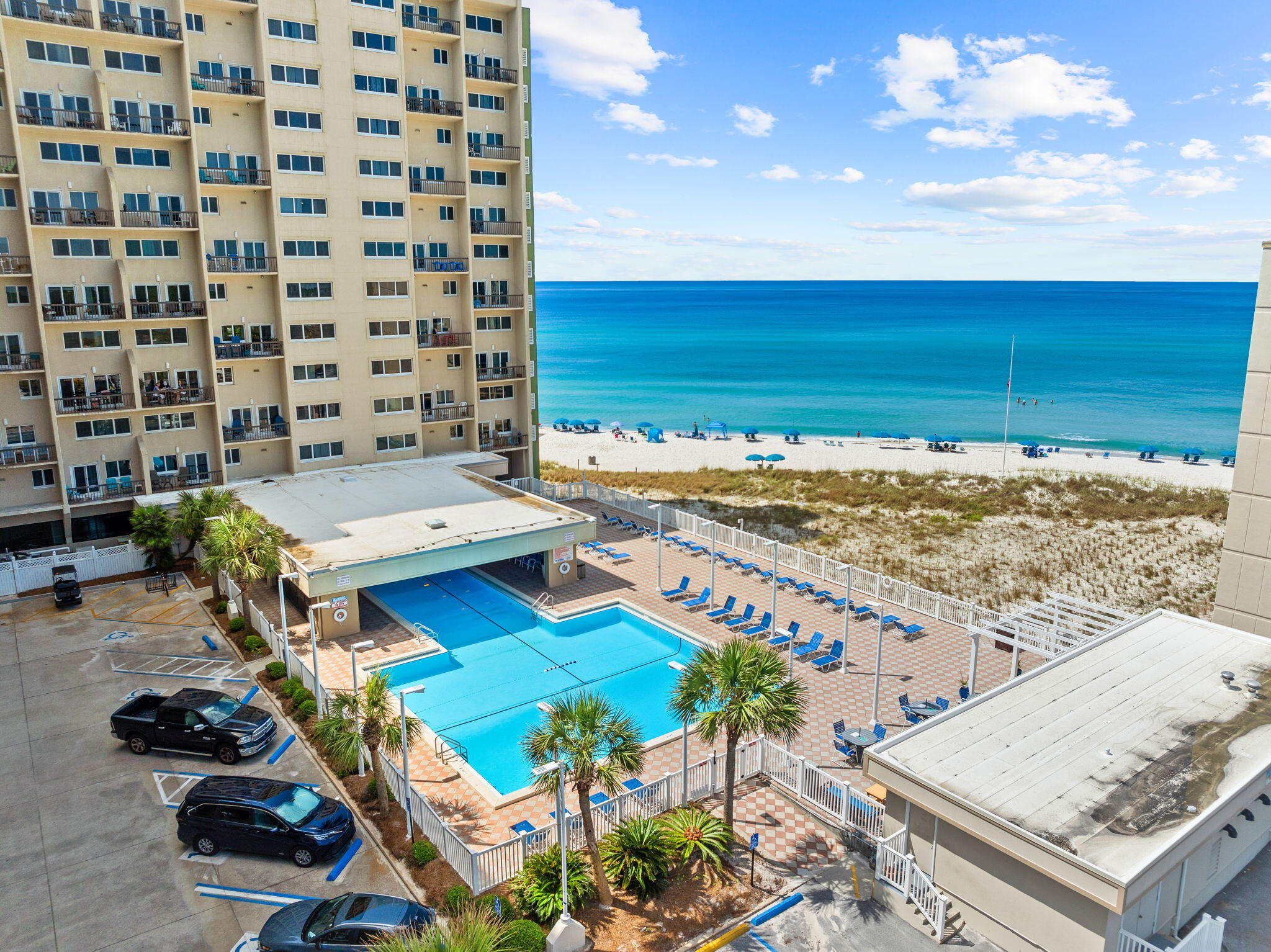 23223 Front Beach Road, Unit C3201 Panama City Beach, FL 32413 - Photo 43 of 45 a terrace with a table and chairs