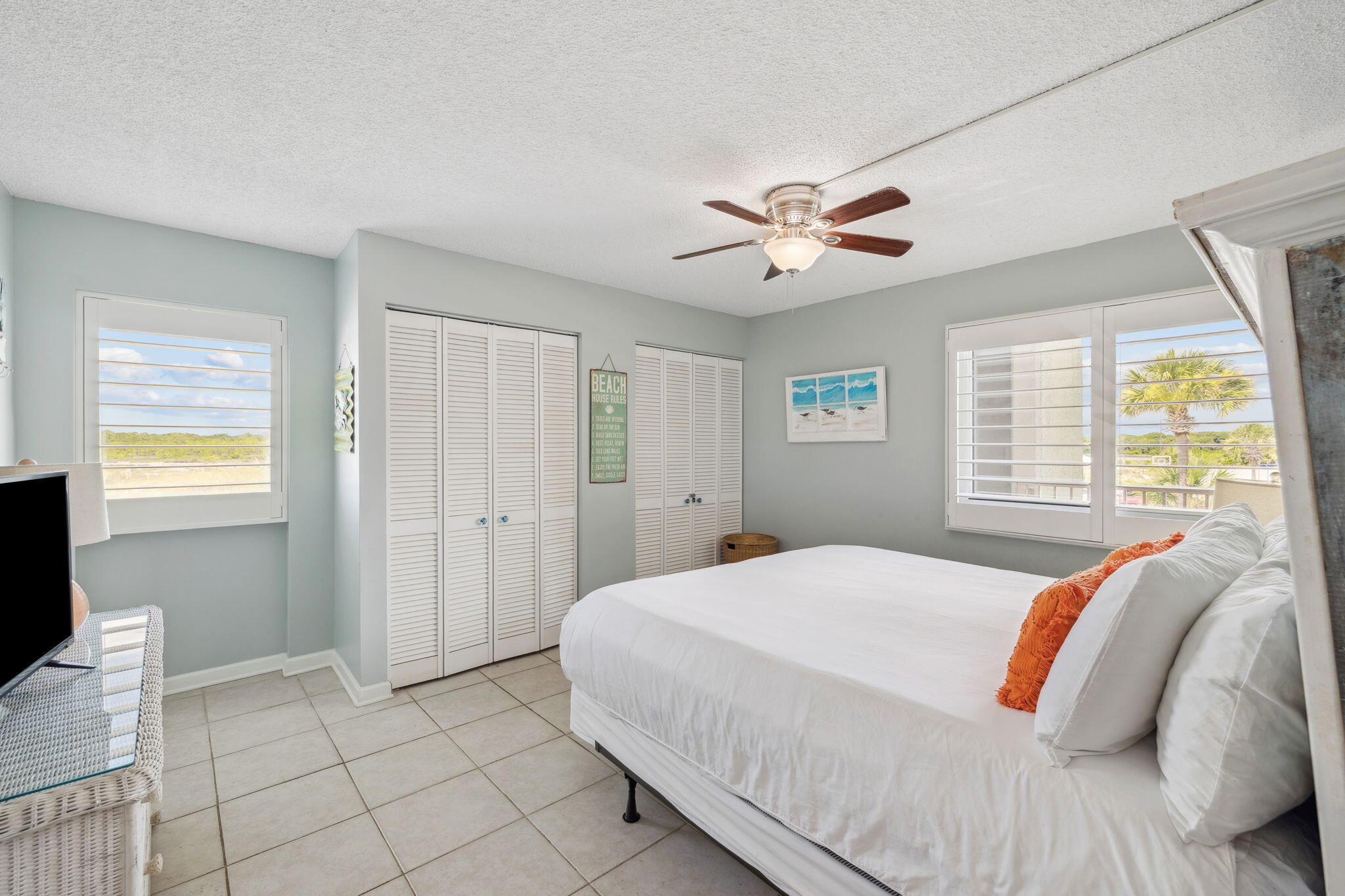 23223 Front Beach Road, Unit C3201 Panama City Beach, FL 32413 - Photo 5 of 45 a bedroom with a bed and a chandelier
