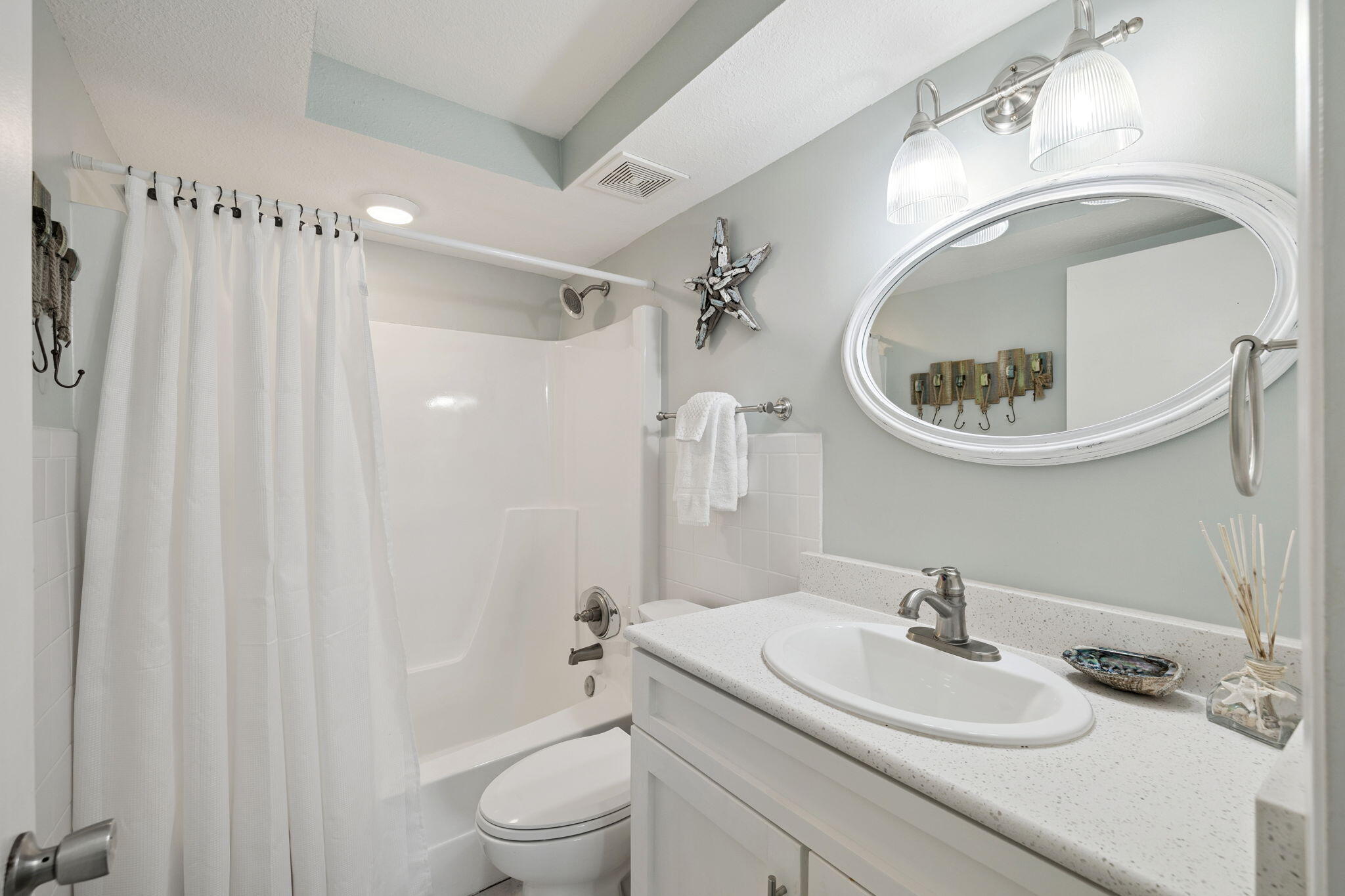 23223 Front Beach Road, Unit C3201 Panama City Beach, FL 32413 - Photo 7 of 45 a bathroom with a sink toilet and shower