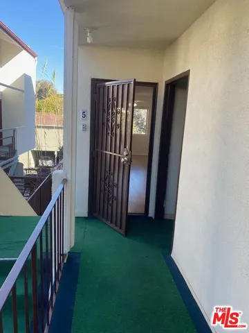 a view of a kitchen from the hallway