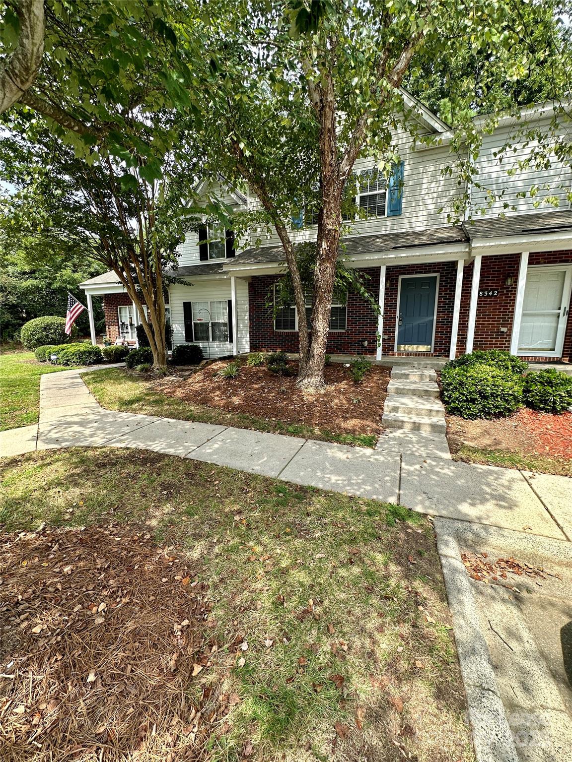 8348 Rudolph Road Charlotte, NC 28216 - Photo 1 of 14 a view of a yard in front of a house