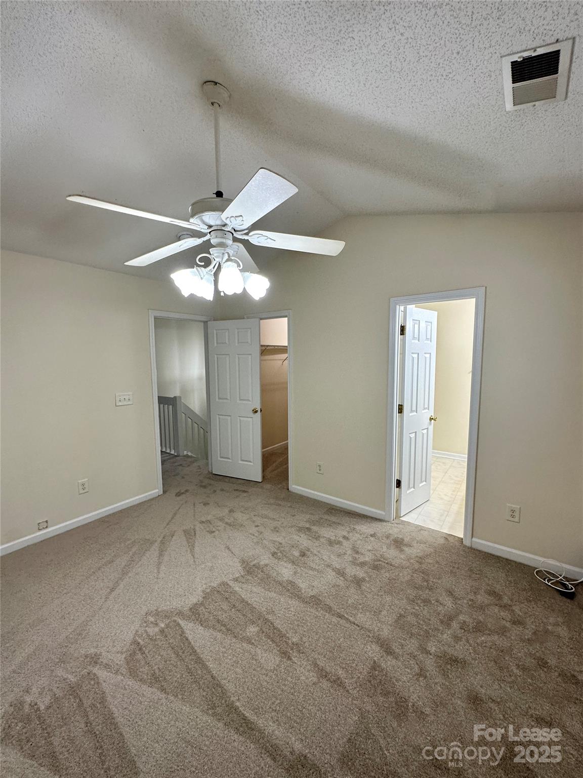 8348 Rudolph Road Charlotte, NC 28216 - Photo 11 of 14 an empty room with a ceiling fan and a window