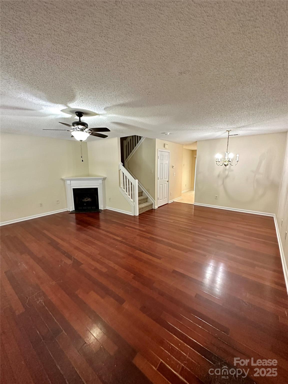 8348 Rudolph Road Charlotte, NC 28216 - Photo 2 of 14 a view of empty room with wooden floor