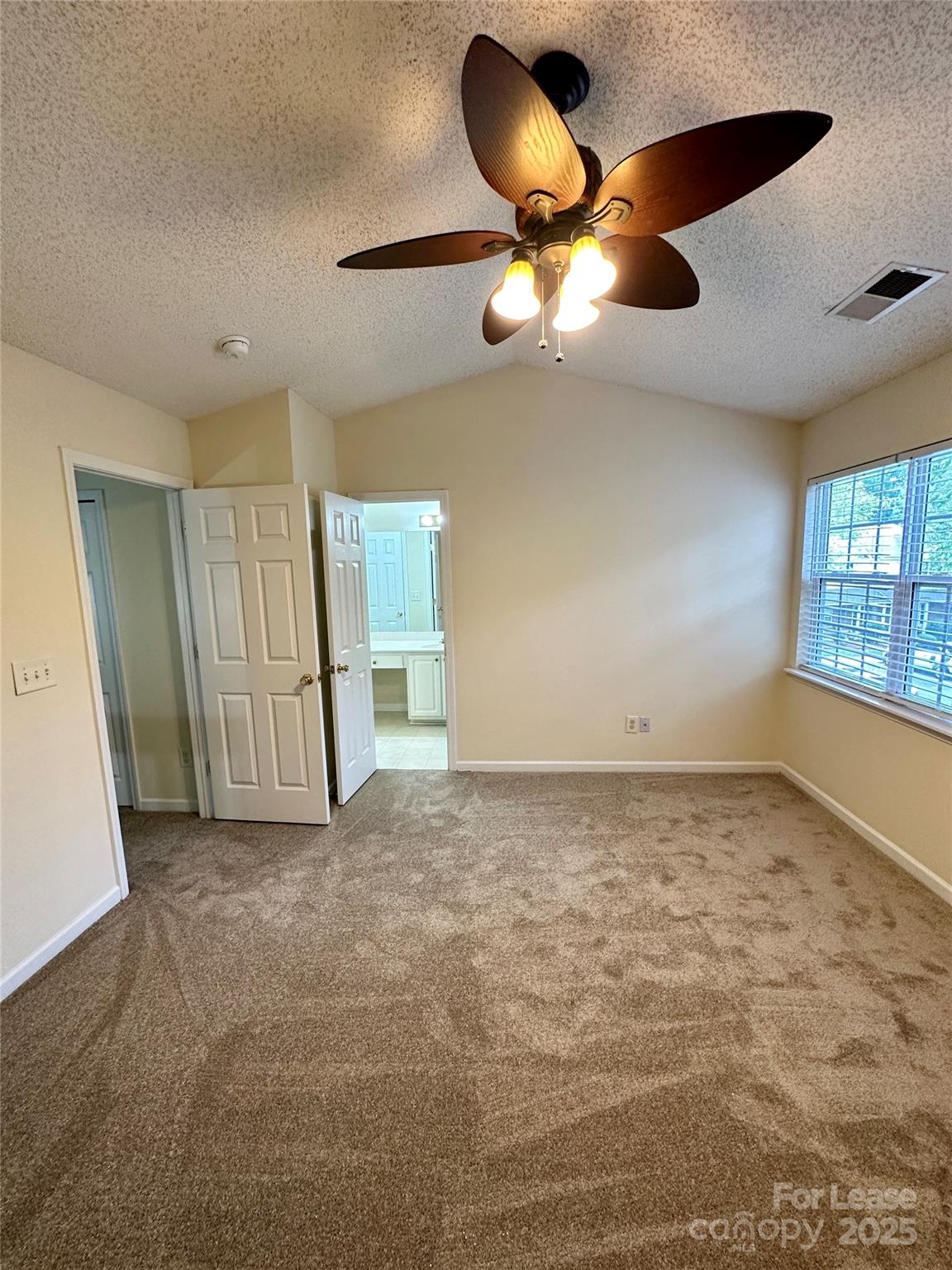 8348 Rudolph Road Charlotte, NC 28216 - Photo 7 of 14 a view of an empty room and window