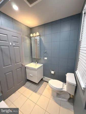 a bathroom with a bathtub toilet and sink