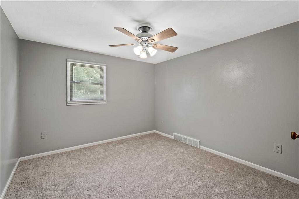 561 Allendale Road New Brighton, PA 15066 - Photo 14 of 25 an empty room with window and ceiling fan