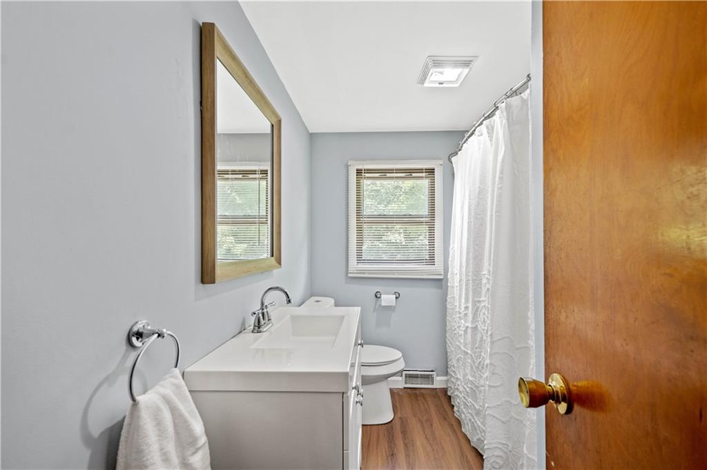561 Allendale Road New Brighton, PA 15066 - Photo 18 of 25 a bathroom with a sink a toilet and a mirror