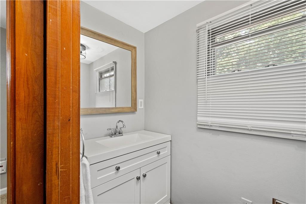 561 Allendale Road New Brighton, PA 15066 - Photo 23 of 25 a bathroom with a sink a mirror and a shower