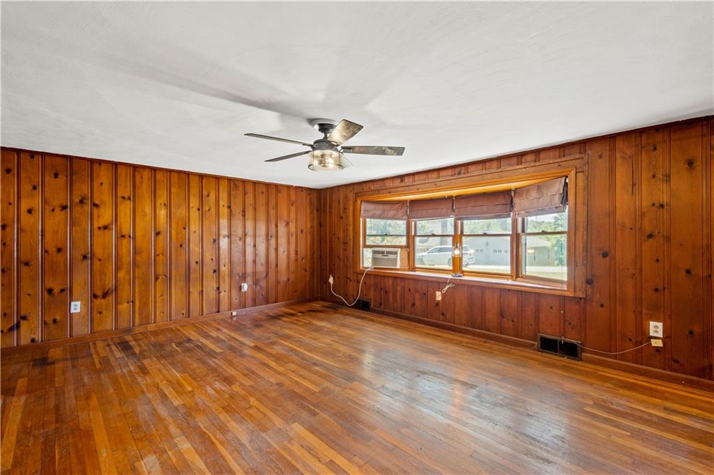561 Allendale Road New Brighton, PA 15066 - Photo 5 of 25 a view of an empty room with a window and wooden floor