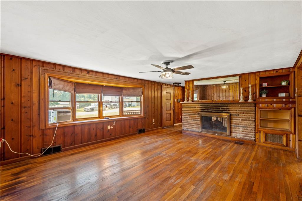 561 Allendale Road New Brighton, PA 15066 - Photo 6 of 25 an empty room with wooden floor and windows