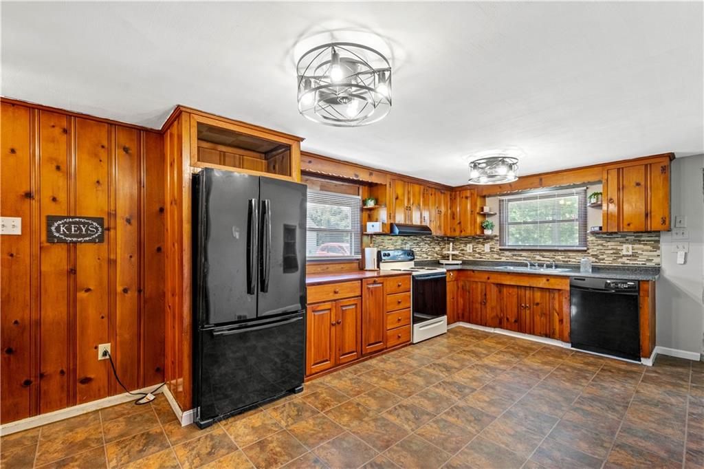 561 Allendale Road New Brighton, PA 15066 - Photo 8 of 25 a kitchen with stainless steel appliances granite countertop a refrigerator oven a sink and dishwasher