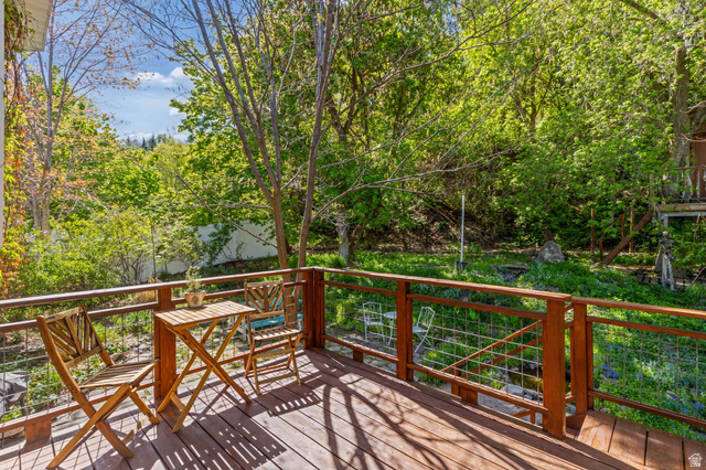 814 Mountain Road Logan, UT 84321 - Photo 38 of 42 Wood-finish deck with a natural wood railing system and wire infill