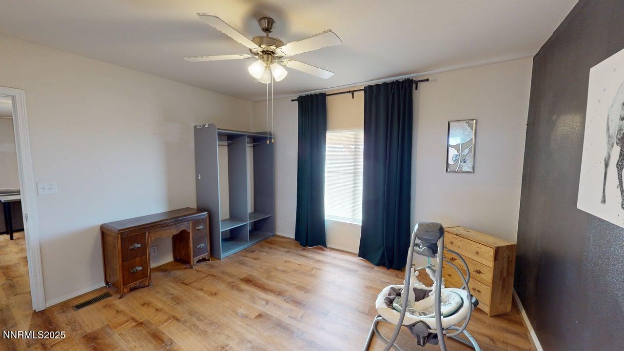 1930 Moccasin Road Battle Mountain, NV 89820 - Photo 17 of 36 a bedroom with furniture and a window
