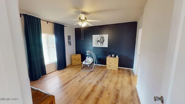 a bedroom with a bed and a table in it