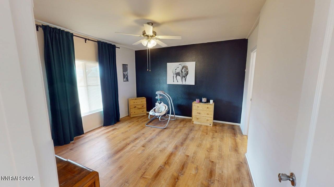 1930 Moccasin Road Battle Mountain, NV 89820 - Photo 19 of 36 a bedroom with a bed and a table in it