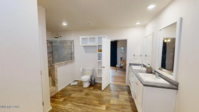 a living room with a sink and a refrigerator