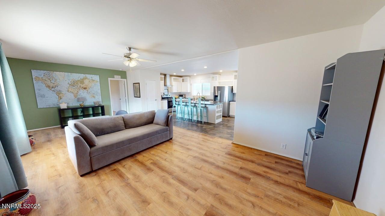 1930 Moccasin Road Battle Mountain, NV 89820 - Photo 9 of 36 a living room with furniture and a wooden floor