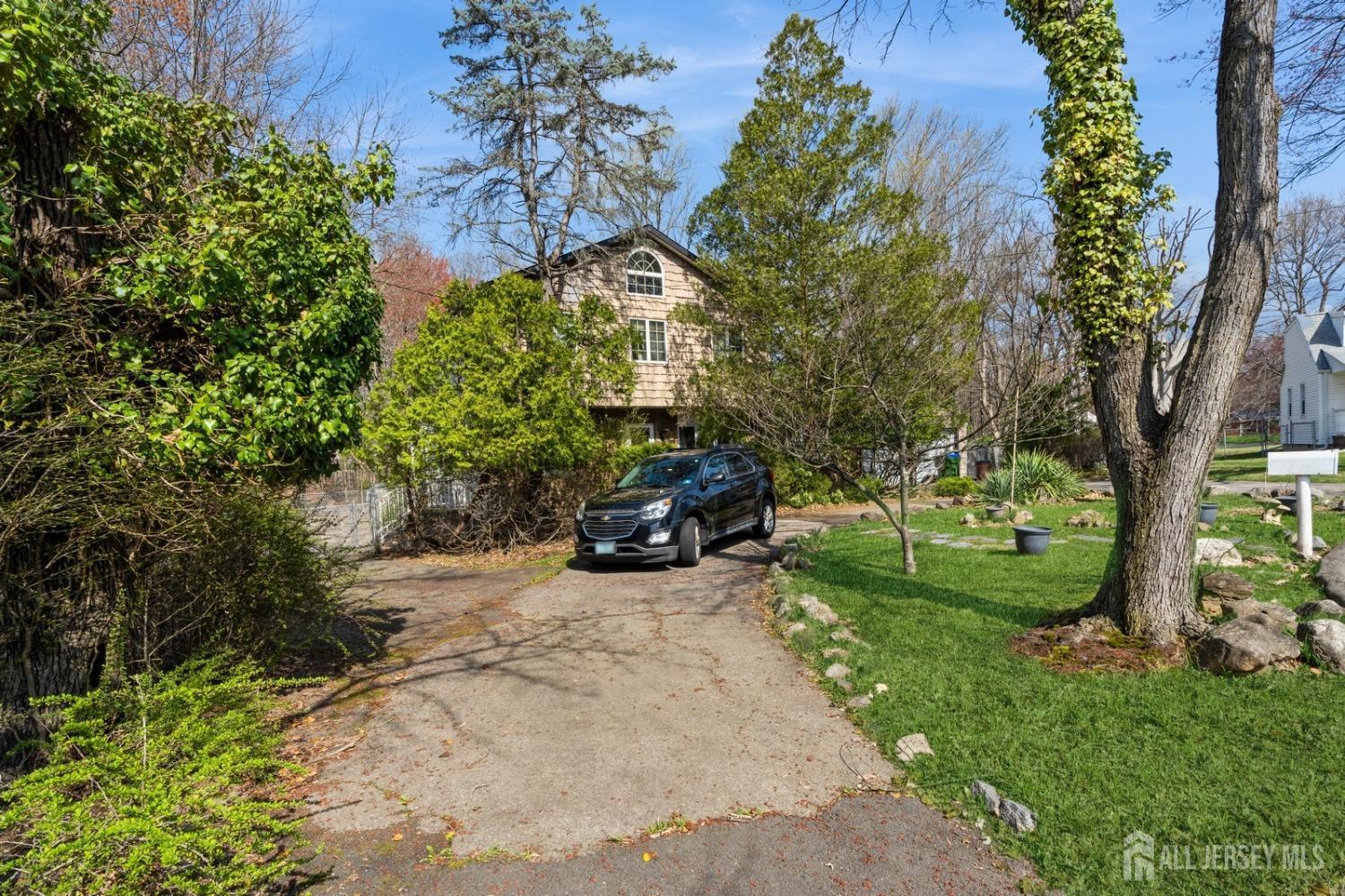4 Stark Place Edison, NJ 08820 - Photo 5 of 12 a view of a backyard with large trees