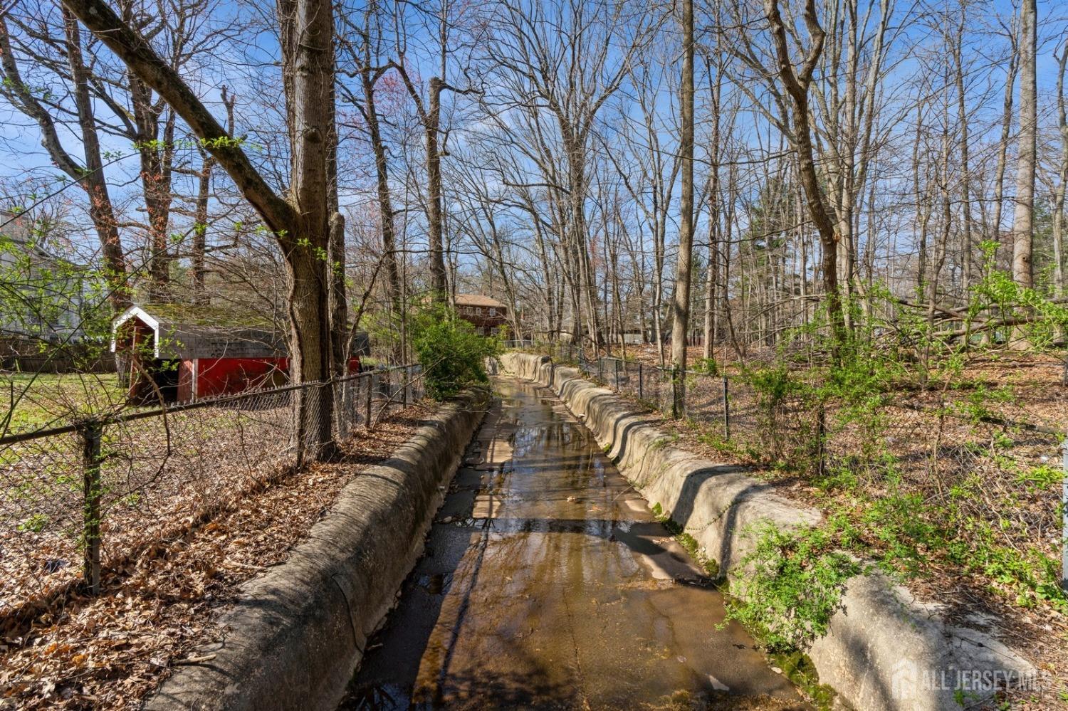 4 Stark Place Edison, NJ 08820 - Photo 8 of 12 a view of a swimming pool with a patio