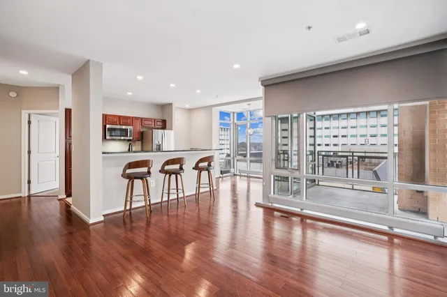 an open kitchen with a table and chairs