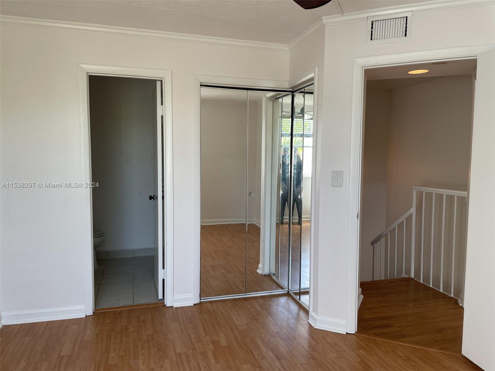 4530 Southwest 68th Ct Circle, Unit 356 Miami, FL 33155 - Photo 11 of 20 an empty room and wooden floor door