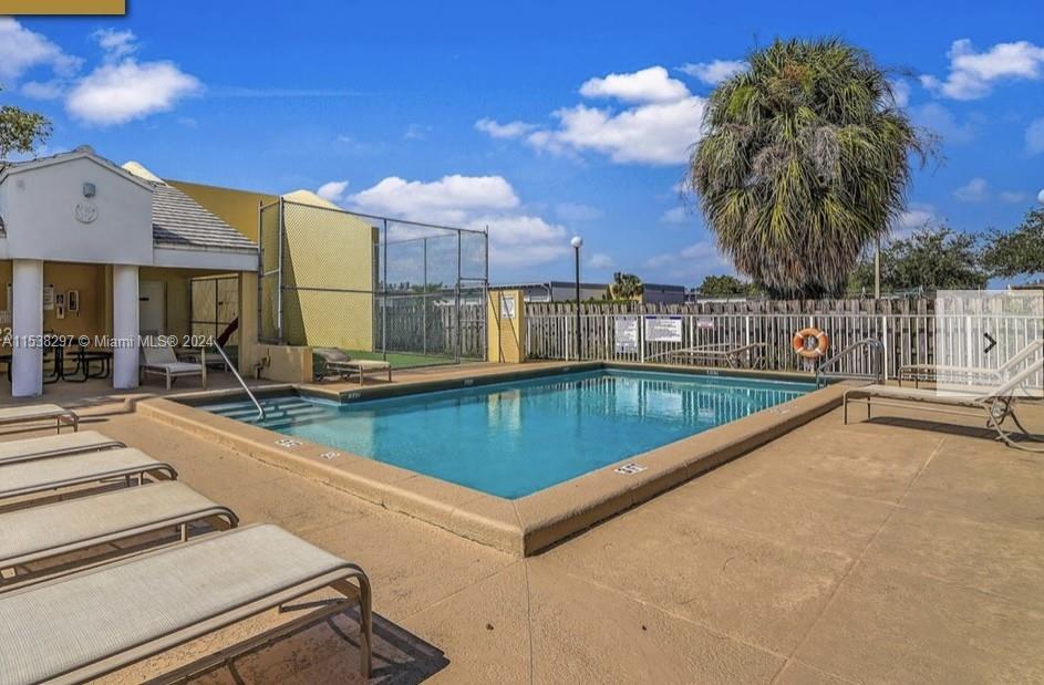 4530 Southwest 68th Ct Circle, Unit 356 Miami, FL 33155 - Photo 20 of 20 a view of a swimming pool with a lounge chair
