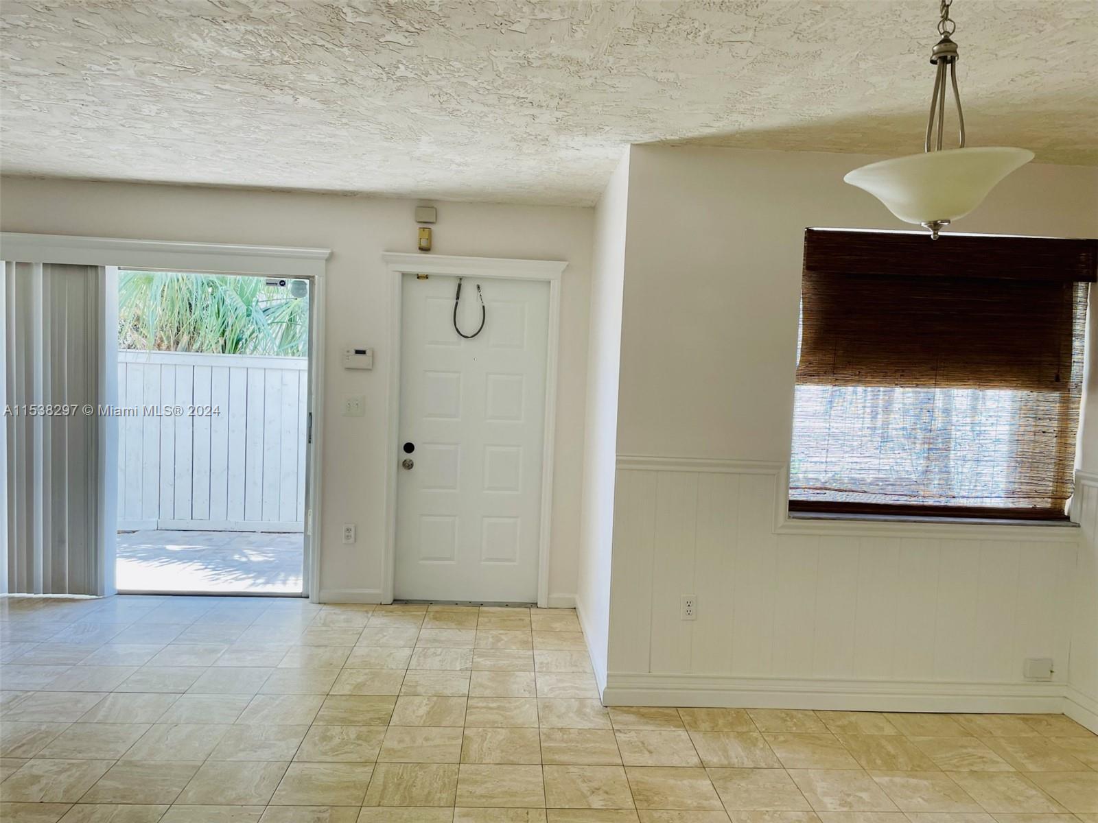 4530 Southwest 68th Ct Circle, Unit 356 Miami, FL 33155 - Photo 4 of 20 a view of a livingroom with a fireplace and window